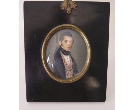 A 19th century French School miniature portrait on ivory of a gentleman, with black cravat, embroidered waistcoat and blue co