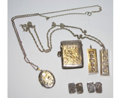 A Silver ingot pendant and chain, another no chain, a sterling silver and chain, a pair of silver cuff links, a silver vesta.