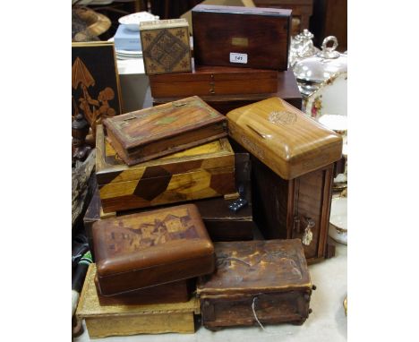 A marquetry playing card box the lid decorated with a village scene; others; a marquetry musical jewellery box; a brass inlai