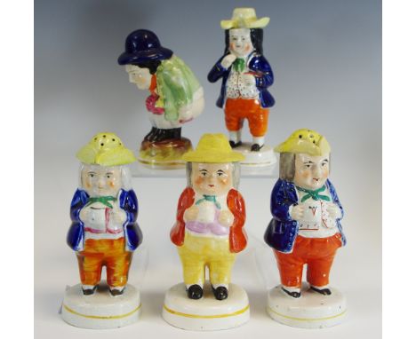 A Staffordshire novelty pepper pot, as a jolly toper, wearing a tricorn hat, 15cm high, c.1880;  another;  others similar, in