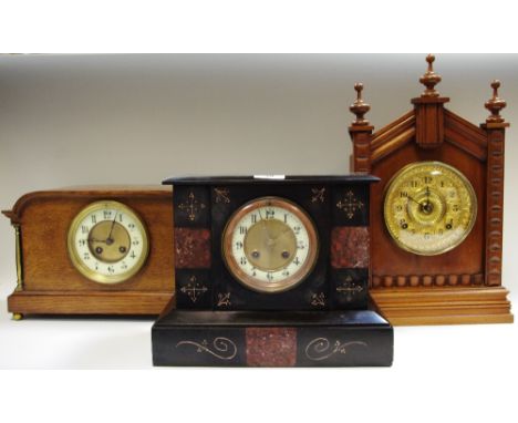 A Victorian slate mantel clock, circa 1870; a German mantel clock, circa 1890; an oak mantel clock, circa 1930