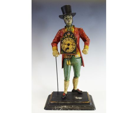 A reproduction figural clock, of a gentleman, wearing a top hat, red jacket, a longcase clock face to his chest, 42cm high