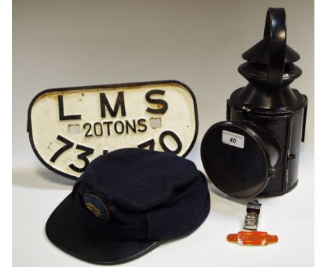 Railway interest - a railway signal lamp; a cast iron plaque LMS 20 ton no. 73170; a driver/ticket inspector peaked cap; ACME