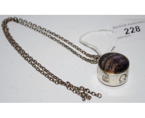 A Blue John pendant in silver mount and chain. 