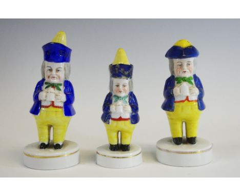 A Staffordshire porcelainious caster, of a Jolly Toper, wearing a tricorn hat, holding a a mug, circular gilt line base, 14cm