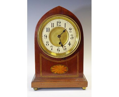 An Edwardian inlaid mahogany lancet mantel clock, with Arabic numerals, the case inlaid with batwing paterea, brass ball feet