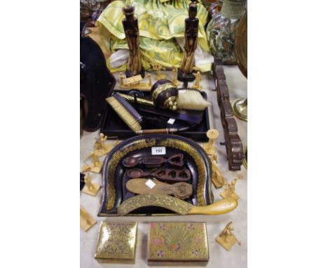 An ebony silver mounted dressing table set comprising tray, hand mirror, clothes brush, trinket dishes, ring stand, pin holde