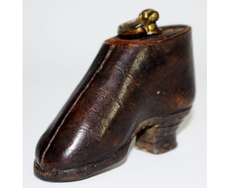 A George III leather novelty snuff box, as a shoe, brass axehead handle, 9.5cm long, c.1800