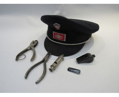 A British Rail uniform cap, ticket punches, whistles etc.