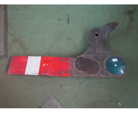A railway home signal arm with bracket and aspects stamped LMS 