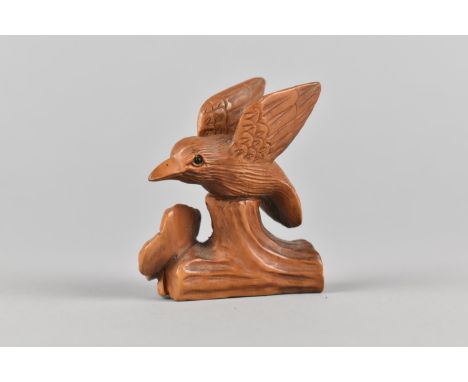 A Carved Wooden Netsuke in the Form of a Hummingbird and Flower, Signed to Base, 4.5cms High