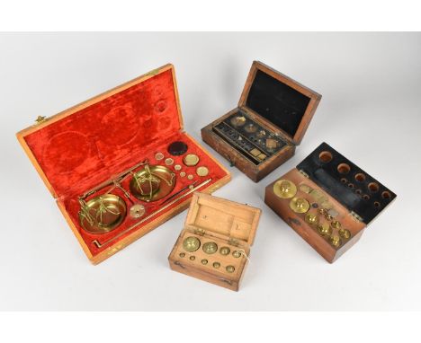 A Collection of Various Edwardian and Later Cased Sets of Scientific Weights and a Cased Pan Scale and Weights Set