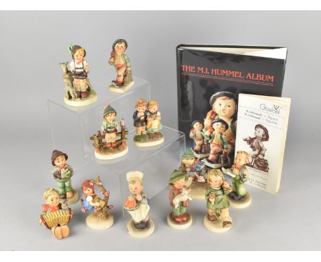 Twelve Goebel Hummel Figures Together with The M.I. Hummel Album