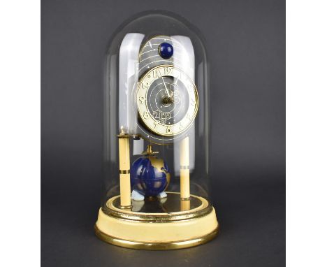A Mid 20th Century Brass and Cream Enamelled Pillar Clock with Globe Weight Under Glass Dome, 27cms High
