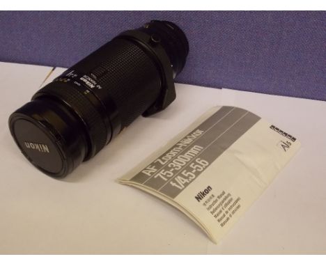 NIKON AF ZOOM -NIKKOR 75-300M F4.5-5.6 ZOOM CAMERA LENS WITH MANUAL