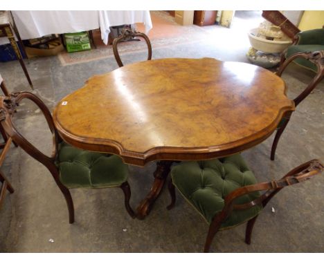 VICTORIAN WALNUT BREAKFAST TABLE,MOULDED SERPENTINE QUARTER VENEERED TOP ON BULBOUS PEDESTAL QUADRAPARTITE BASE AND FOUR ELEG