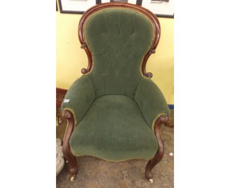 GENTLEMANS VICTORIAN SHOWFRAME ARMCHAIR UPHOLSTERED IN BUTTON BACK GREEN VELOUR ON SCROLL FORE LEGS WITH CERAMIC CASTORS