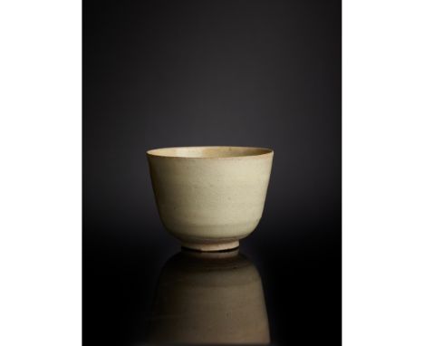 WHITE-GLAZED STONEWARE CUP TANG DYNASTY 唐 白釉杯 thinly potted of deep U-shape, supported on a low flaring solid foot, covered o