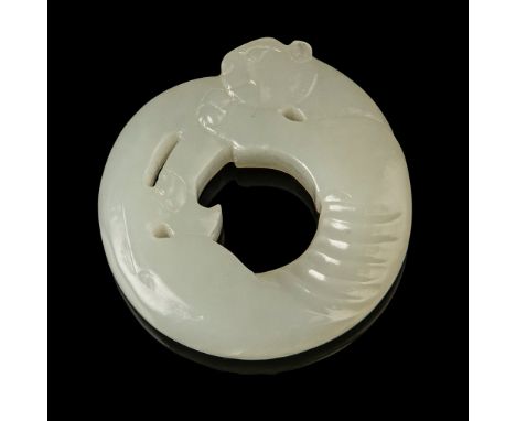 WHITE JADE CARVING OF A TIGER PENDANT QING DYNASTY, 18TH-19TH CENTURY 清 白玉雕虎形珮 the circular pendant carved in the form of a t