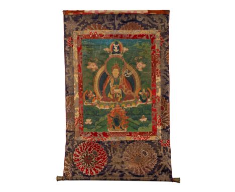 THANGKA DEPICTING PADMASAMBHAVA QING DYNASTY, 19TH CENTURY 清 蓮花生大士唐卡 distemper on cloth, the Guru Rimpoche joined by his two 