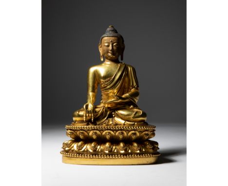 GILT BRONZE FIGURE OF BUDDHA MING DYNASTY, YONGLE MARK 明 大明永樂年施刻款 銅鎏金佛座像 finely cast and portrayed seated in dhyanasana, righ