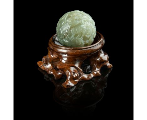 CELADON JADE 'BOYS AT PLAY' BALL MING DYNASTY OR LATER 明或以後 青玉雕嬰戲紋珠 carved in relief with boys in dance or riding on a large 