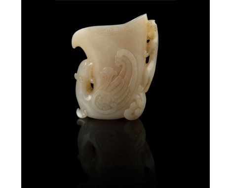 WHITE JADE 'PHOENIX AND CHI DRAGON' LIBATION CUP QING DYNASTY, 19TH CENTURY 清 白玉雕鳳凰螭龍犀角杯 in the archaic style, the horn-shape