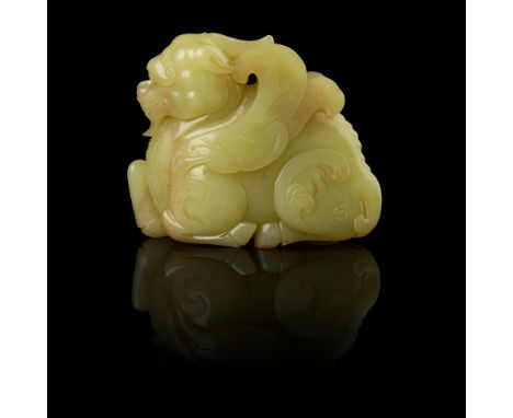 YELLOW JADE CARVING OF A QILIN QING DYNASTY, 18TH-19TH CENTURY 清 黃玉雕麒麟擺件 well depicted recumbent with the hind legs and front