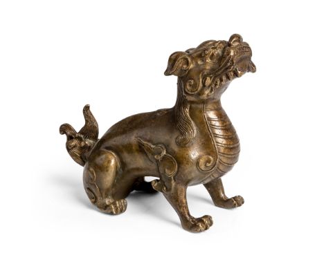BRONZE FIGURE OF A QILIN LATE QING DYNASTY-REPUBLIC PERIOD, 19TH-20TH CENTURY 清末民初 銅鑄麒麟擺件 the mythical beast modelled with it
