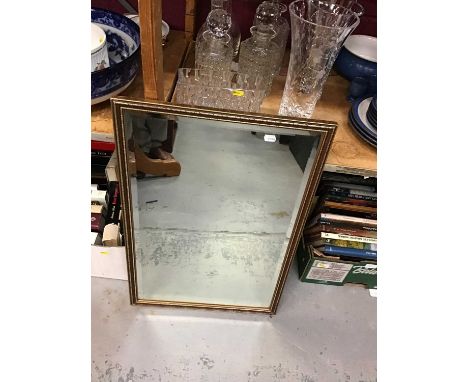 Bevelled wall mirror