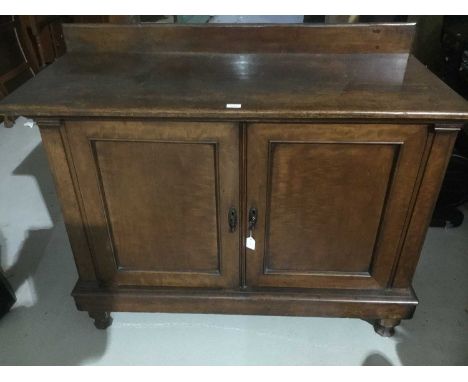 Victorian mahogany enclosed cupboard, shelf back and interior of drawers enclosed by panelled cupboard doors on spool feet, 1