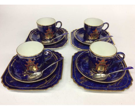 Art Deco four place set of coffee cans, saucers and cake plates by George Jones with gilt painted decoration on blue ground, 