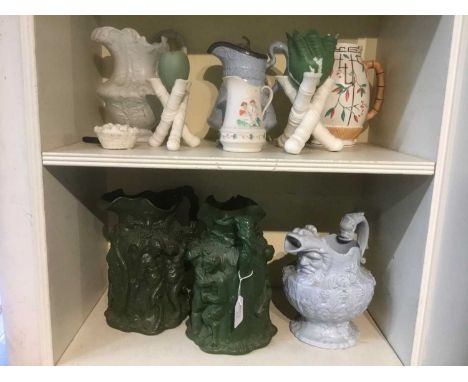 Two large Victorian green glazed Parian Bacchus jugs, and various other Parian ware jugs and vesselsCondition report: The can