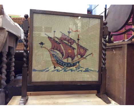 Oak fire screen with embroidered ship panel on barley twist supports, oak umbrella/stick stand and long footstool with tapest