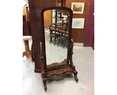 Victorian mahogany cheval mirror on shaped plateau on splayed scroll feet on castors 152 cm high, 74 cm wideCondition report: