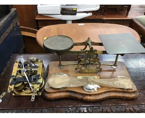 Set of brass scales together with early 20th century postal scales and work mechanism