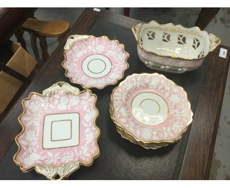 19th Century English porcelain (possibly Minton) part desert service with pate sur pate decoration on pink groundCondition re