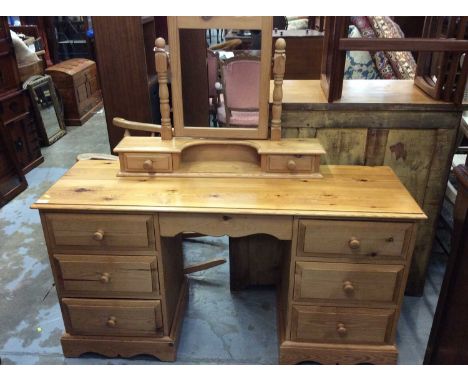 Pine dressing table with associated mirror. 140cm wide x 45cm deep x 74cm high (excluding mirror)