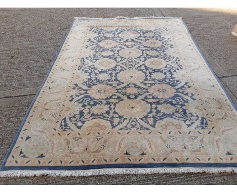 Large rug with floral decoration on blue and cream ground, 298cm x 204cmCondition report: Overall appears in sound order, fre