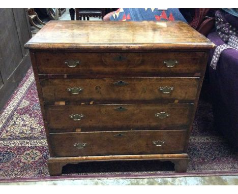 George I style burr walnut veneered chest of four long graduated drawers with brass handles on bracket feet (early elements, 