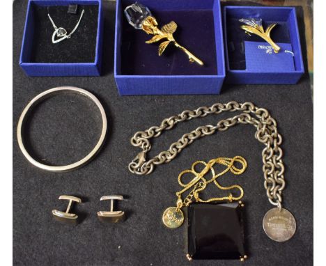 Costume Jewellery - a Swarovski crystal pendant necklace; floral brooches; others Waterford crystal Rebel pendant necklace; T