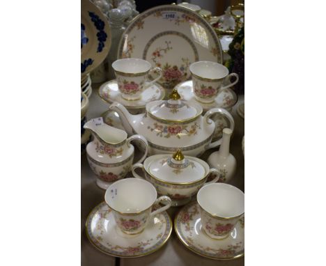 A Royal Doulton Canton pattern six setting tea service, including cups, saucers, side plates, cake stand, teapot, milk jug, t