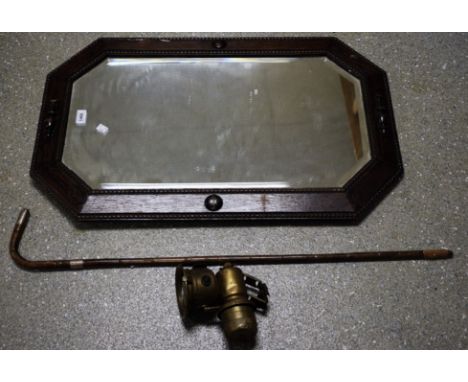 A silver mounted walking cane; a Lucas King of the Road lamp; a dark oak framed wall mirror (3) 