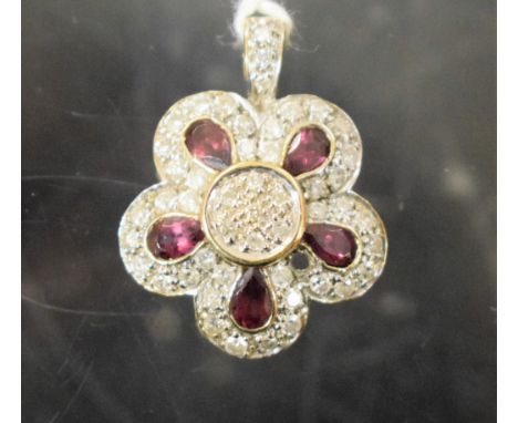 A 9ct gold white sapphire and amethyst flowerhead pendant, 4g gross