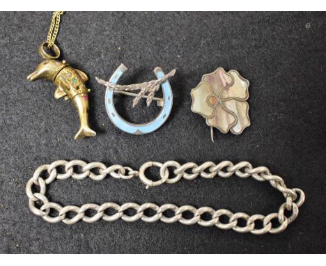 A silver gilt Dolphin pendant; a silver bracelet; An Art Nouveau silver and mother of pearl Pansy brooch; an enamel and silve