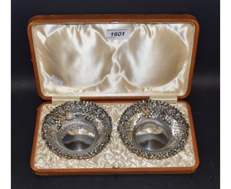 A pair of silver pierced sweetmeat baskets, 12cm diameter, Chester 1899, cased 