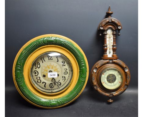 An early 20th century Junghans sunburst clock, painted circular dial, Arabic numerals, octagonal case, with pendulum; a wall 