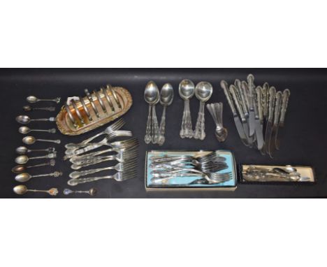A silver souvenir teaspoon, Zanzibar; others, Mombasa, Marseille, Espaňa; a set of Oneida silver plated flatware, knives, for