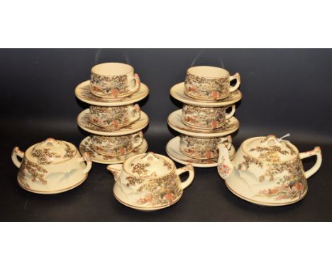 A Japanese Satsuma tea service, for six, comprising teacup, saucers, teapot, milk jug, sugar bowl, decorated with fanciful bi