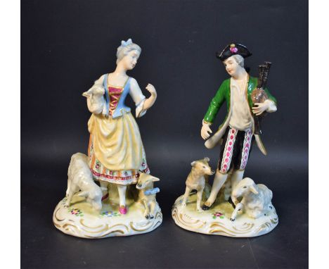A pair of 19th century French figures, of a shepherd and shepherdess, he with bag pipes, she holding a lamb, scroll bases, 17